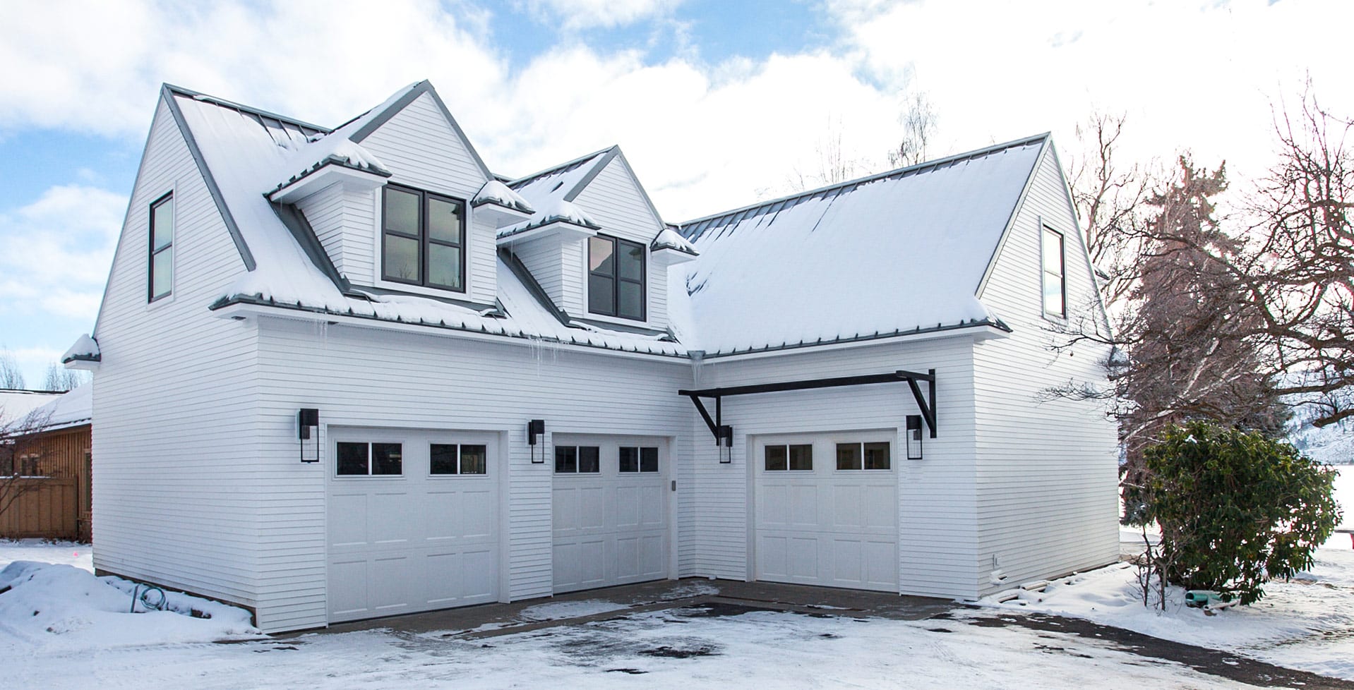 White house with 3 garages