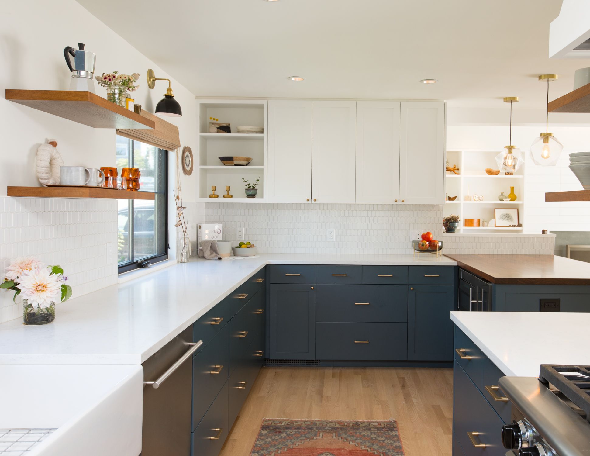 kitchen with white walls and dark blue gray cabinets